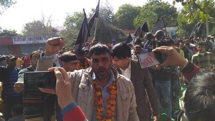 Protesters waving black flags in Jind, Haryana during the arrival of Amit Shah