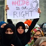 From Examination Centres to Passport Offices: The ‘Humiliation’ and ‘Identity Stripping’ of Muslim Women