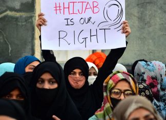 From Examination Centres to Passport Offices: The ‘Humiliation’ and ‘Identity Stripping’ of Muslim Women